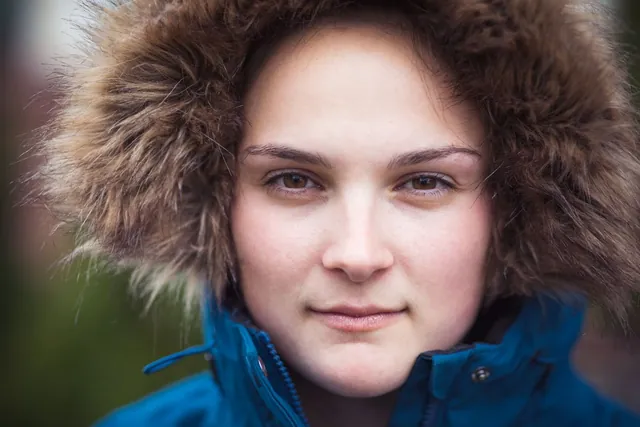 Young woman in a fur-trimmed hood, photographed by GCShutter