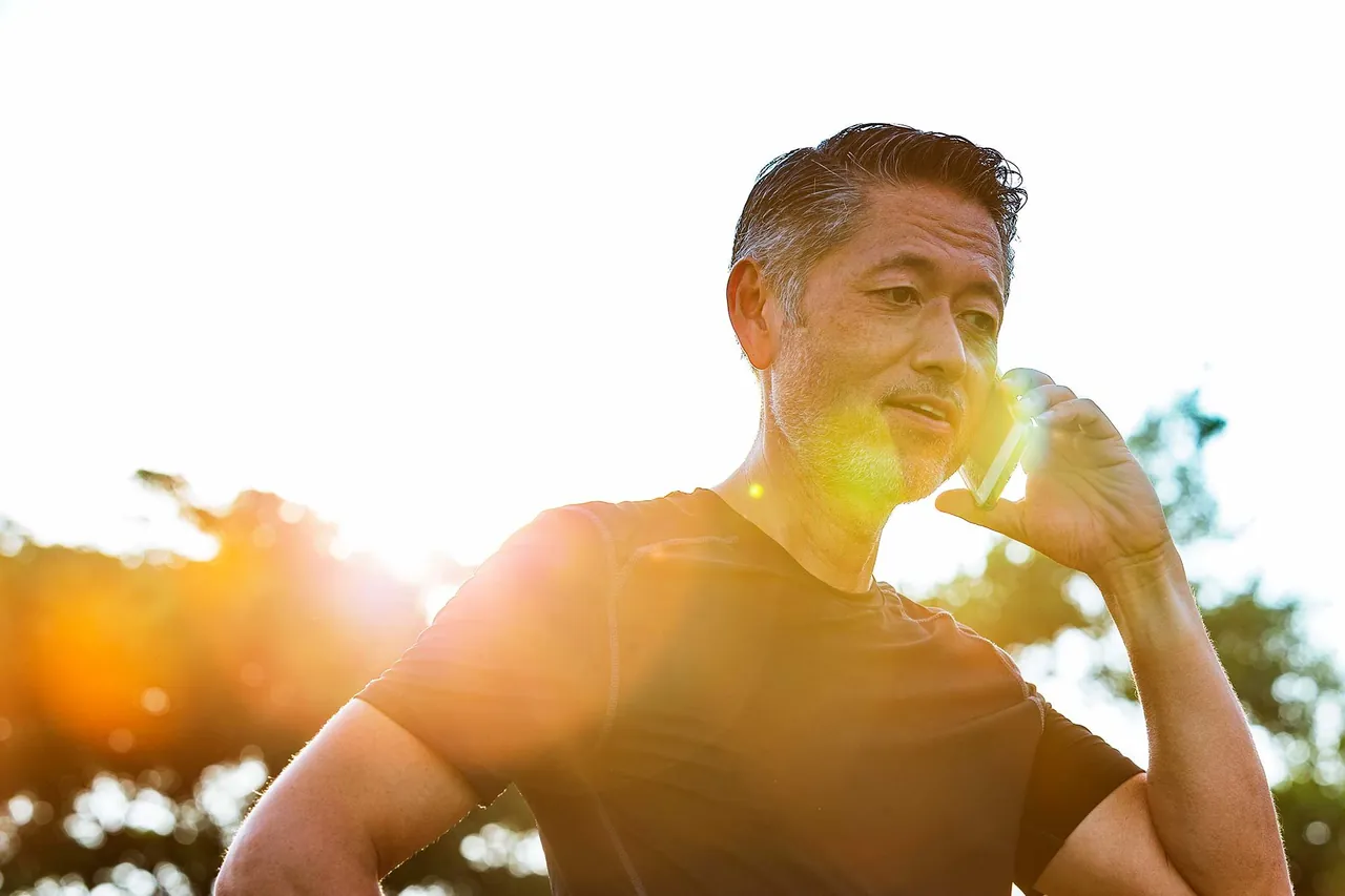 Man laughing in the sunshine, photographed by GCShutter