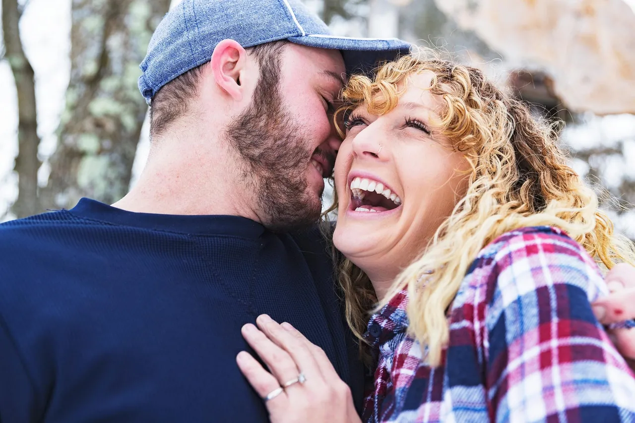 Laughing couple outdoors, photographed by GCShutter