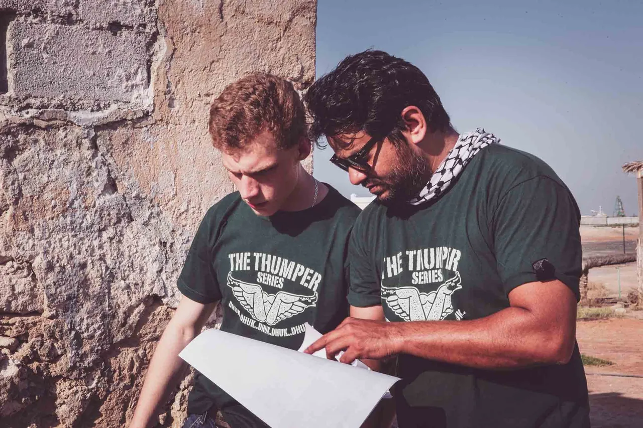 Two men studying a map together, photographed by GCShutter