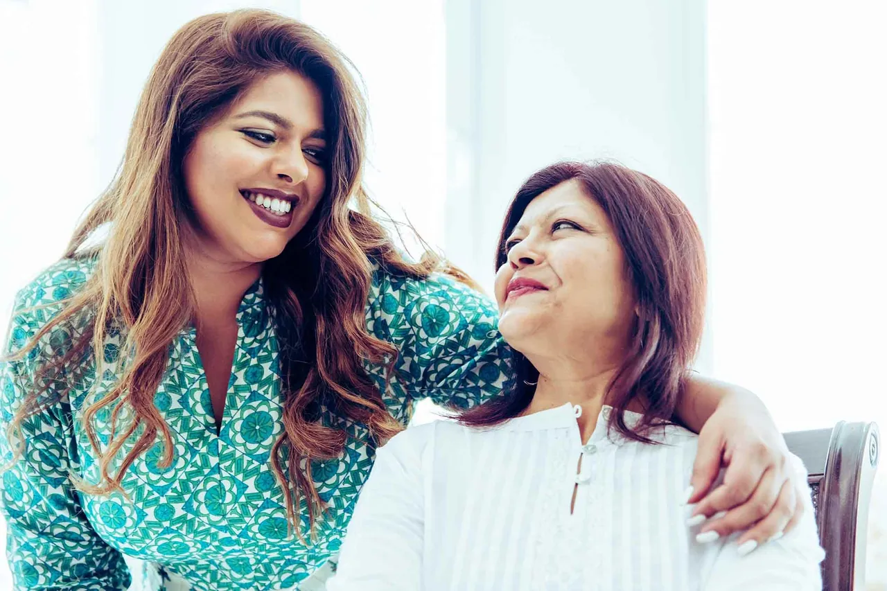 Mother and daughter embracing, photographed by GCShutter